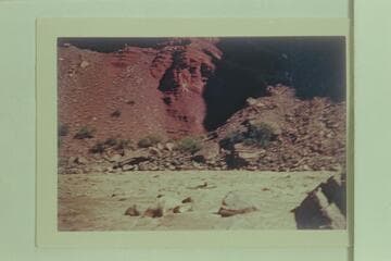 One of the Nevills sadiron skiffs running Hance Rapid.  The course is a sneak on the left