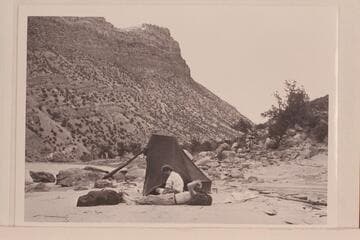 Marie and Joe Desloge in camp on left bank at lower end of Whirlpool Canyon