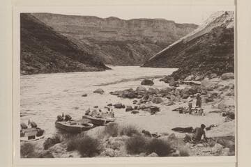 Camp at Mile 12.  Buzz Belknap is in the foreground.  John Schulz and Brian [sic] Rowlands at the tables