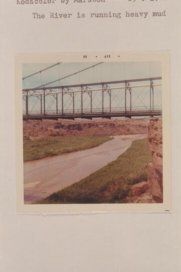 Down river from the new highway bridge at Cameron.  The river is running heavy mud