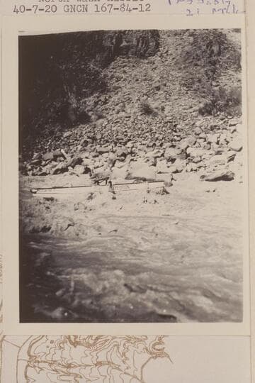 Hugh Cutler at the oars of a Nevills sadiron.  This is probably in North Wash Riffle.  Probably 21 Mile Rapid