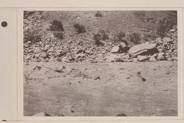 The "Dellenbaugh" running Hance Rapid, Mile 76.  Parley Galloway is at the oars and Eddy rides as passenger