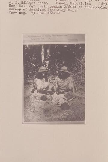 Jim-mi-pin-mi and Sika-whi cutting buckskin fringe.  Valley of the Moapa, a tributary of the Rio Virgin in Southern Nevada.  Piute Tribe.  Powell Expedition, 1873