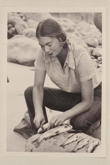 Anne Desloge cleans some of the rainbow trout caught in Tapeats Canyon