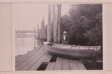 The "Julius" (Holmstrom's boat) at Coquille, Oregon.  Mrs. Holmstrom sold the boat and the stern has been cut off and the decks removed to use for fishing with outboard motor.  The present owner is behind the skiff
