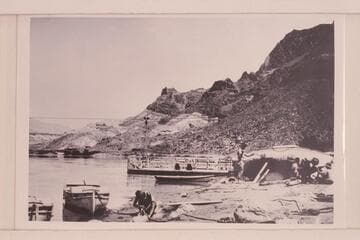 The heavy boats of the Eddy Expedition being overhauled at Lees Ferry 1927, July 13.  The "Powell" shows on the left.  The "Coronado" is center and the "Dellenbaugh" is on the beach