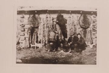 Frank A. Brewer and meat in the pot.  The one-in-a-thousand gold-mounted Winchester.  Some fur.  George Scott and neice