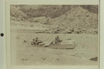 Crew of one of Eddy's boats pulling clear in Badger Creek Rapid after lining the upper part