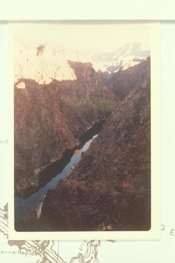 Upriver from knoll west of saddle on the spurtrail which reaches the river at Mile 80.9 left bank