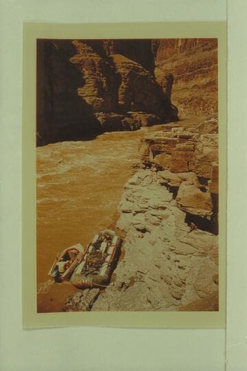 The glass outboard motorboat "JAX" and the Hatch pontoon No. 1 moored at the ledge below Supai