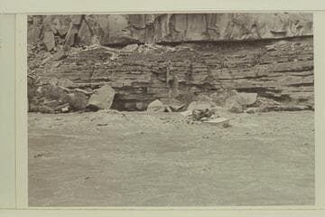 Running Syncline Rapid- San Juan River.  Evie Mull on stern, Nevills as boatman and Liz Fox at bow