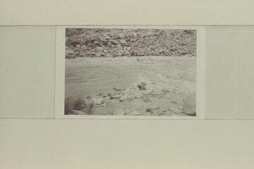 13-Foot Rapid, mouth of Cha Canyon, Mile 11.  Nevills in boat riding through rapid alone