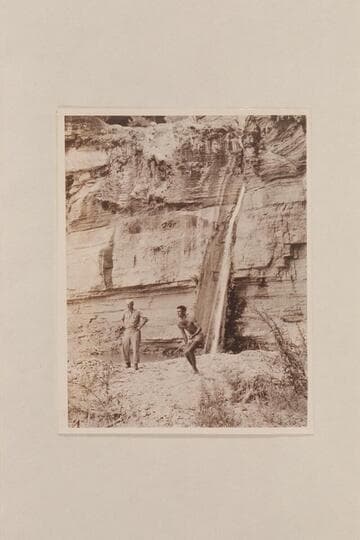 Randall Henderson watches Garth Marston at the pitch game; Emory [sic] Falls; Grand Canyon