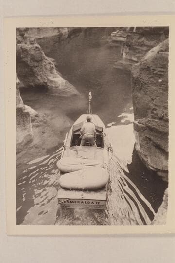 The "Esmeralda" being run up into the lagoon at Supai Creek, Ed Hudson at the helm