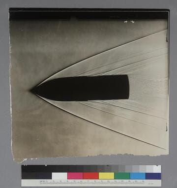 Shadow photograph of air shock waves off a 37 mm shell, at the U.S. Army Ballistic Laboratory