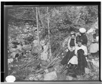 Three unknown women and a man in an unknown location