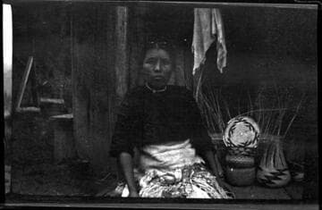 Nettie Ruben (Karok), with some of her baskets in progress