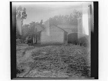 Unidentified house and concrete tunnel or bridge