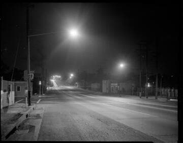 Street scene and streetlights near unknown substation
