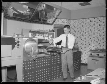 Man cooking at a demonstration kitchen grill