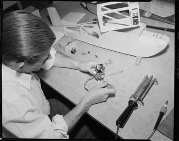 Man working with electronics at his workbench