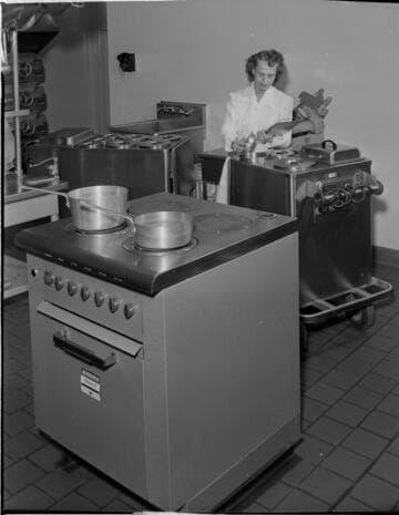 Commercial kitchen with range and roll carts