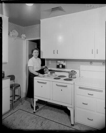 Lady cooking with electric range