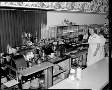 Food preparation in a coffee shop behind counter
