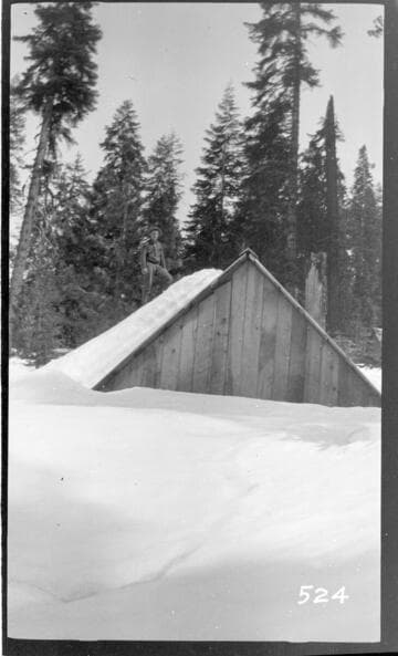 A wooden shack in a snow scene at Wolverton Reservoir