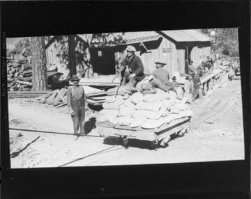 Tramway hauling bags of cement up to Agnew Lake and Gem Lake dam construction sites