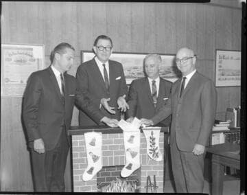 Executives posed exchanging checks