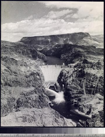 Hoover Dam spilling upstream view overhead showing Lake Mead and dam spilling on Nevada side