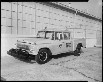 Edison trucks with Medallion Home advertisements on doors