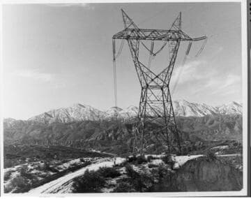 One tower of Edison's growing network of 500kV transmission lines stands sentinel in Cajon Pass in the winter of 1973