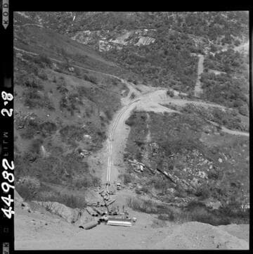 2-8 Tule Siphon -  Progress photo.  View from half way up outlet slope looking toward intake; distributing pipe along outlet slope