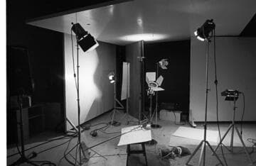 Photo set-up and a display poster promoting energy conservation in Spanish