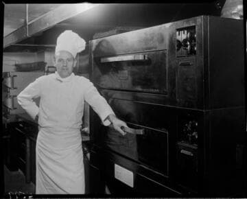 Chef standing by baking ovens
