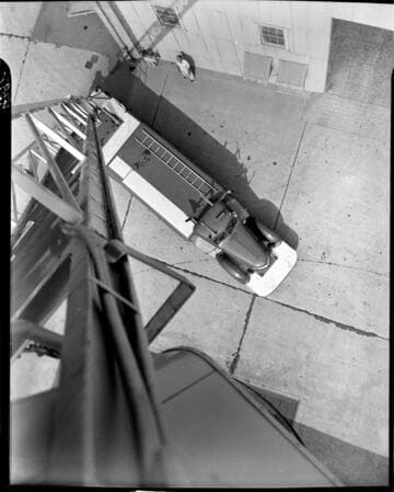 Looking down at truck from extended bucket