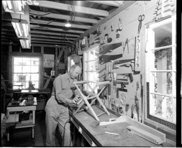 Woodworker working in his garage on a chair