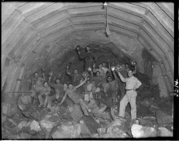 Group photo of tunnel crew in mouth of Big Creek 4's power tunnel