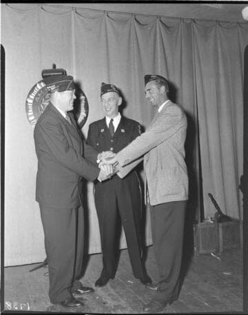 Three American Legion members shaking hands