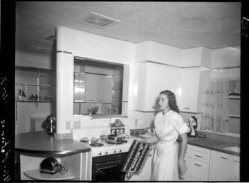 Woman in model kitchen