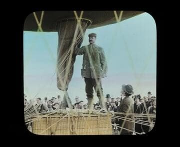 Captain Mueller, pilot, in final stages of inspection and "tying off" after inflation completed