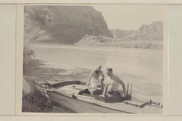 Otis Marston, Margaret Marston, and Ed Hudson checking the "Esmeralda" after trail runs at Lees Ferry