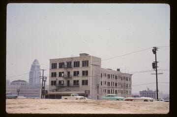 Last big apartment building going, at 3rd and Olive Streets