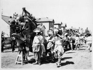 Chinese dragon being carried through residential street