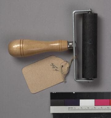 One ink roller with metal frame and wooden handle