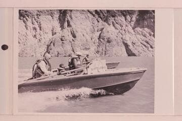 "RATTLESNAKE" and "CACTUS" cruising on Lake Mead.  Lois Sanderson is hidden by Joe Desloge, Hugh Cutler sits amidships and Rod Sanderson is at the wheel.  Ballard Atherton sits aft on the "CACTUS" while Bill Beer is at the wheel