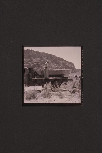 18 foot boat being transported to river by:  Don, Vern and Dick