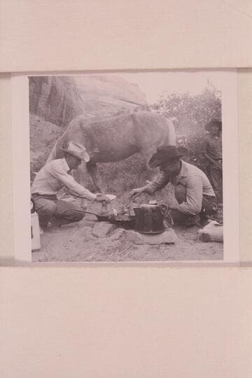 Tom Daly and Buster Ordiway create some pancakes for breakfast as Tobe Owl looks on;  Middle Fork of 73